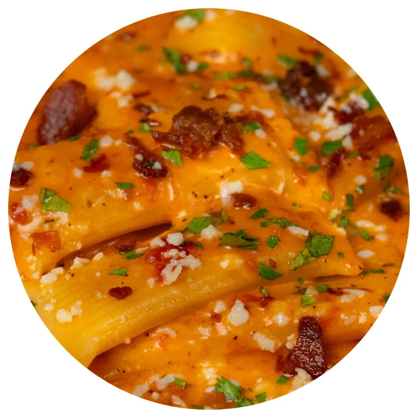 Rigatoni in a creamy tomato sauce topped with parsley