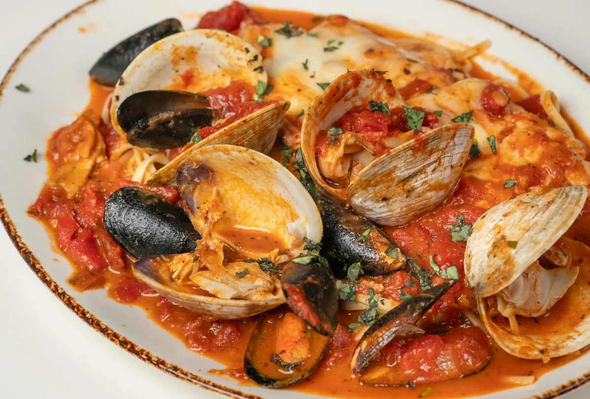 Seafood pasta with mussels and clams in tomato sauce